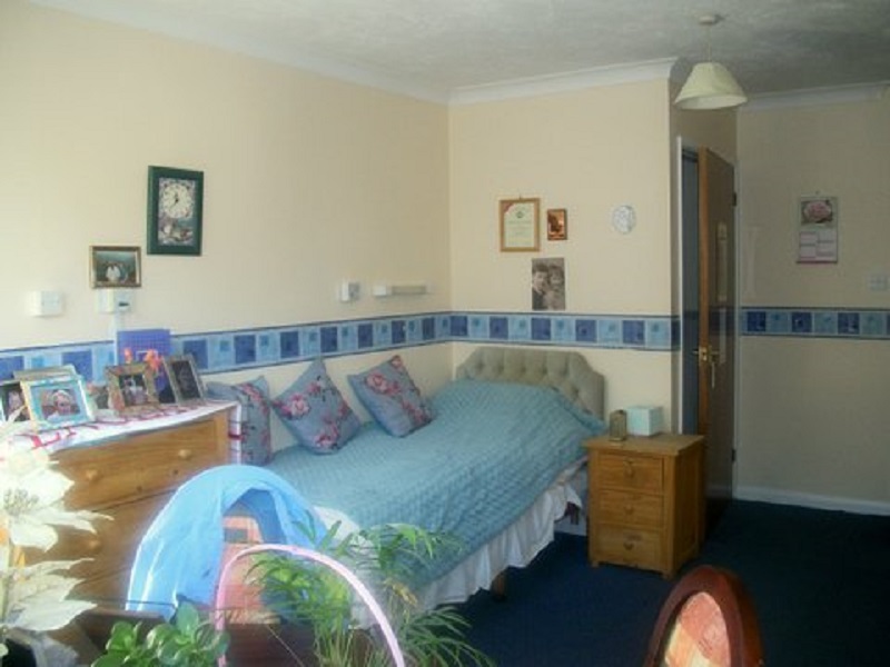 Comfortable resident bedroom with personal touches