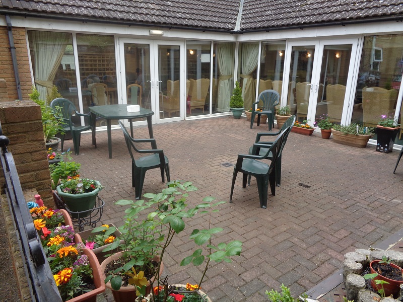 Rosewood courtyard patio with garden dining area